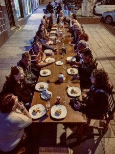 students sitting at the long table